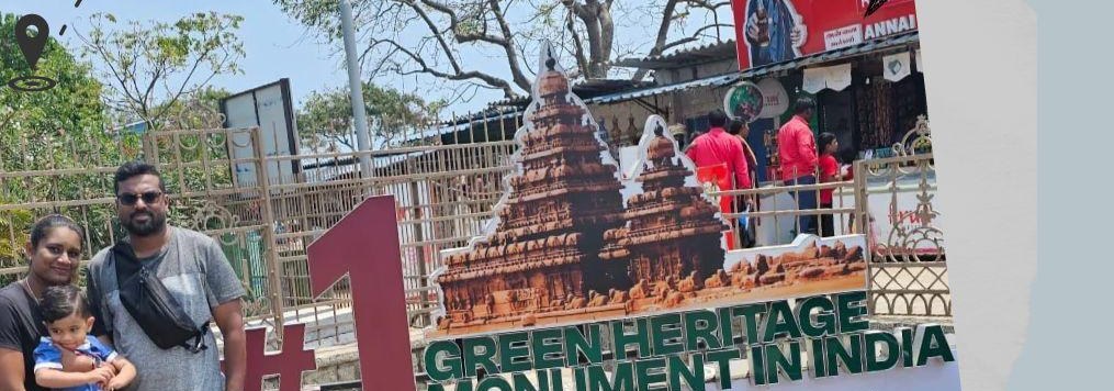Travellers photographed at a heritage monument during their temple tour