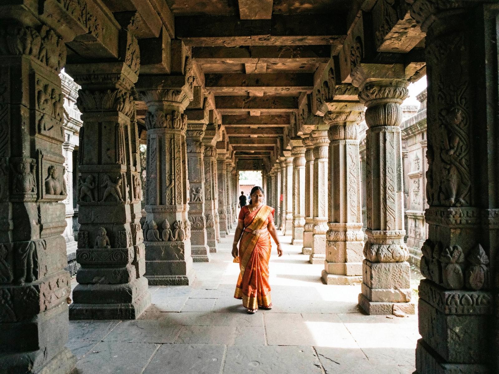 Stone temple corridor with carved pillars in Kanchipuram